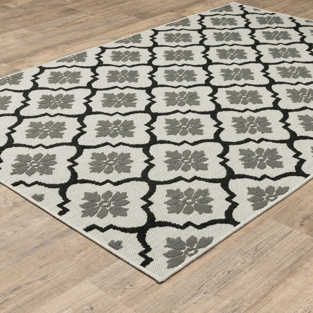 2' X 4' Beige and Black Geometric Stain Resistant Indoor Outdoor Area Rug