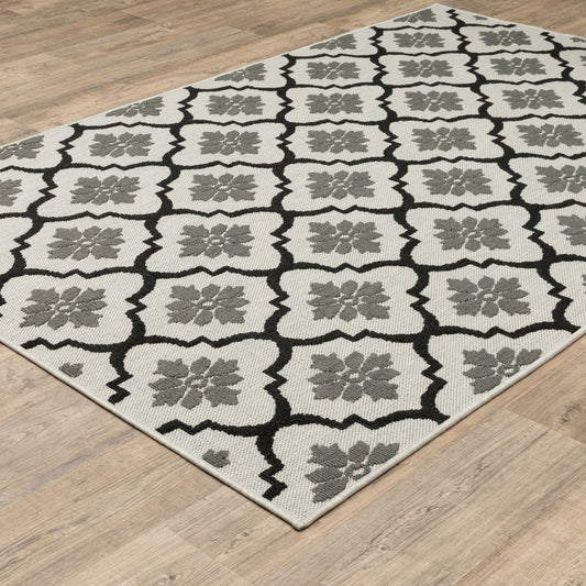 2' X 4' Beige and Black Geometric Stain Resistant Indoor Outdoor Area Rug