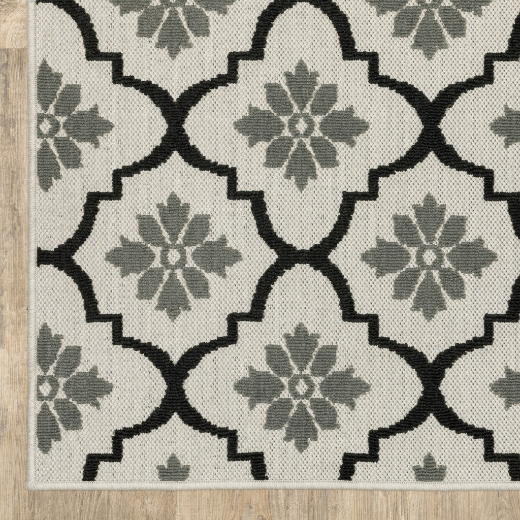 2' X 4' Beige and Black Geometric Stain Resistant Indoor Outdoor Area Rug