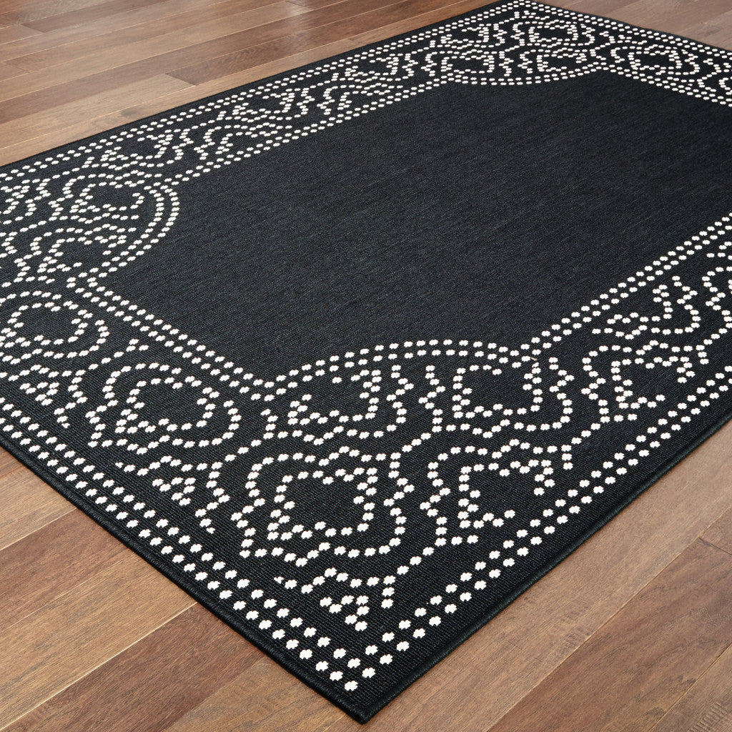 9' X 13' Black and Ivory Stain Resistant Indoor Outdoor Area Rug