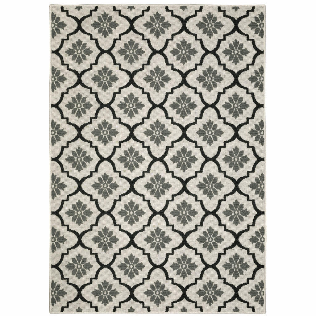 7' x 9' Beige and Black Geometric Stain Resistant Indoor Outdoor Area Rug