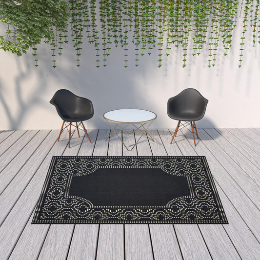 7' x 10' Black and Ivory Stain Resistant Indoor Outdoor Area Rug