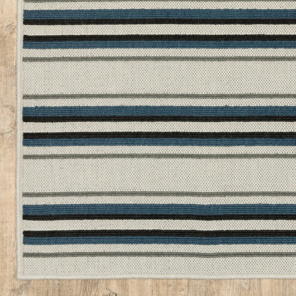 7' x 9' Blue and Beige Geometric Stain Resistant Indoor Outdoor Area Rug