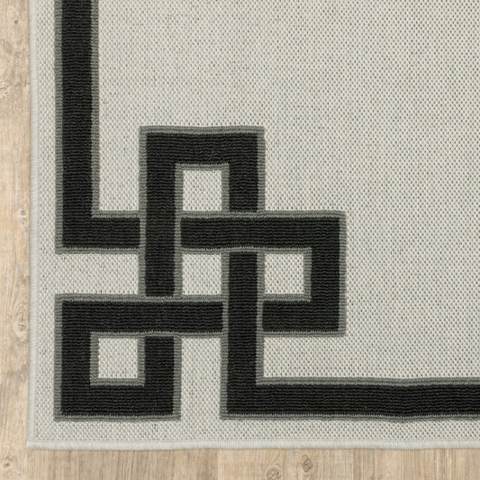 2' X 4' Beige and Black Stain Resistant Indoor Outdoor Area Rug