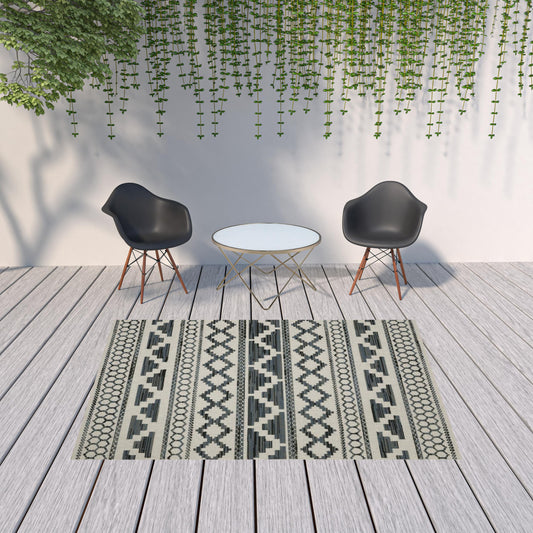 7' x 9' Blue and Beige Geometric Stain Resistant Indoor Outdoor Area Rug