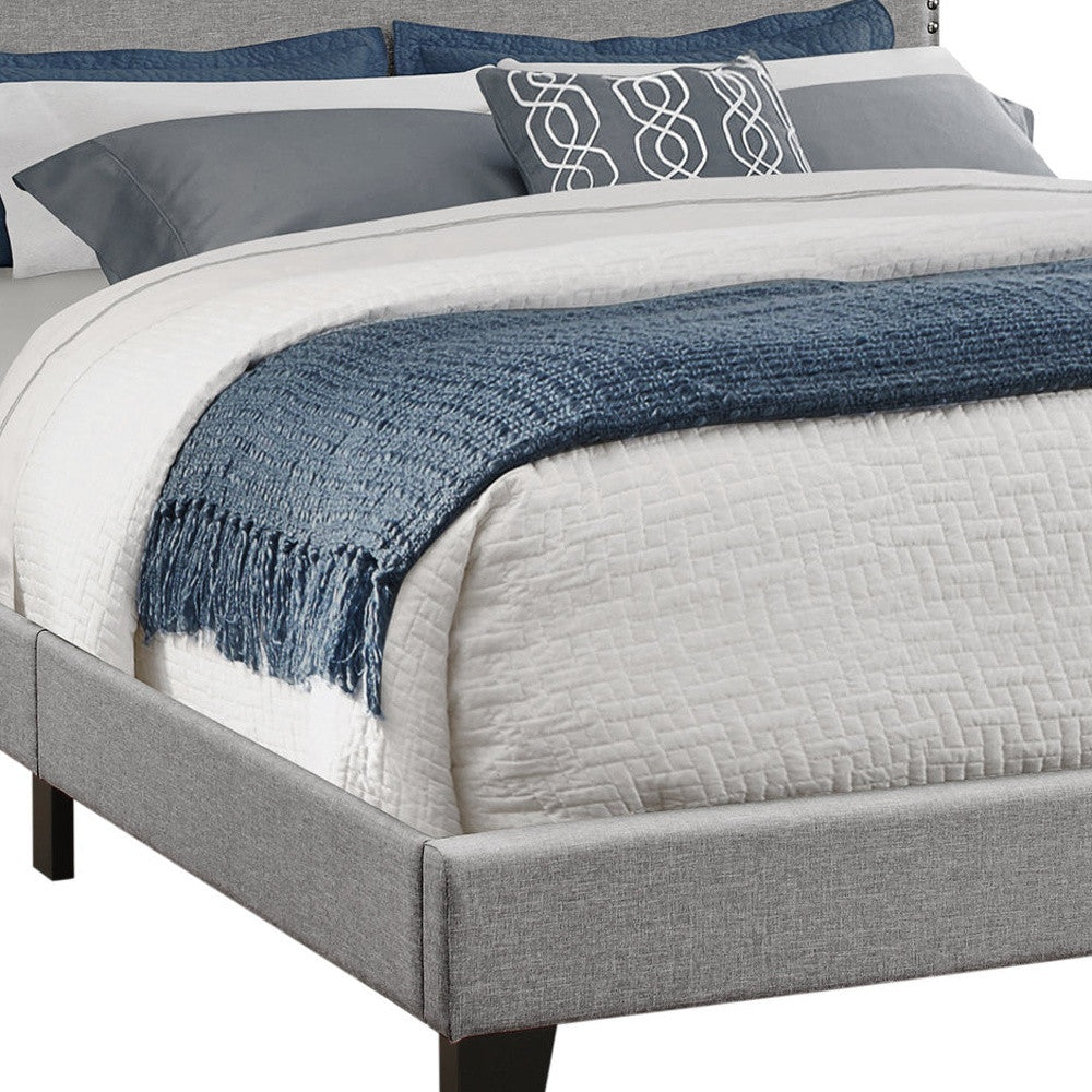 Gray Standard Bed Upholstered With Nailhead Trim And With Headboard