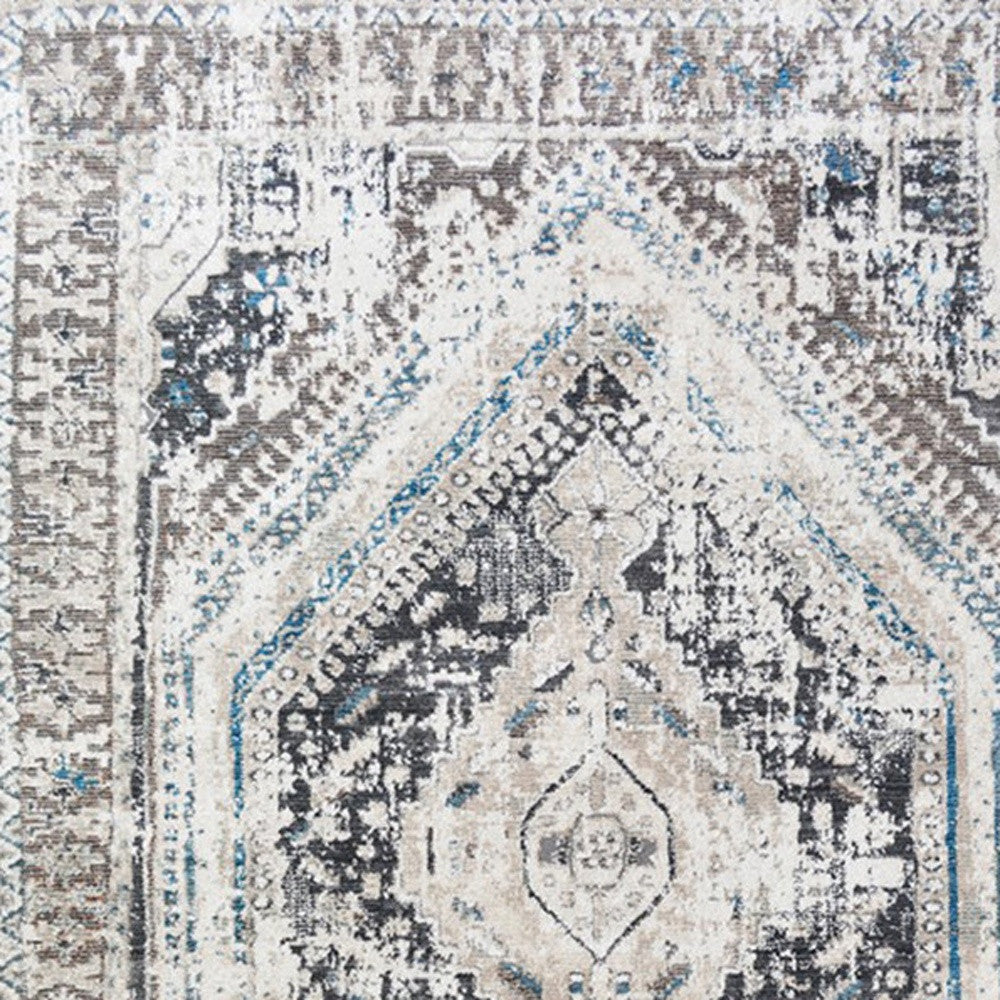 9' X 13' Gray Beige and Blue Geometric Distressed Area Rug With Fringe