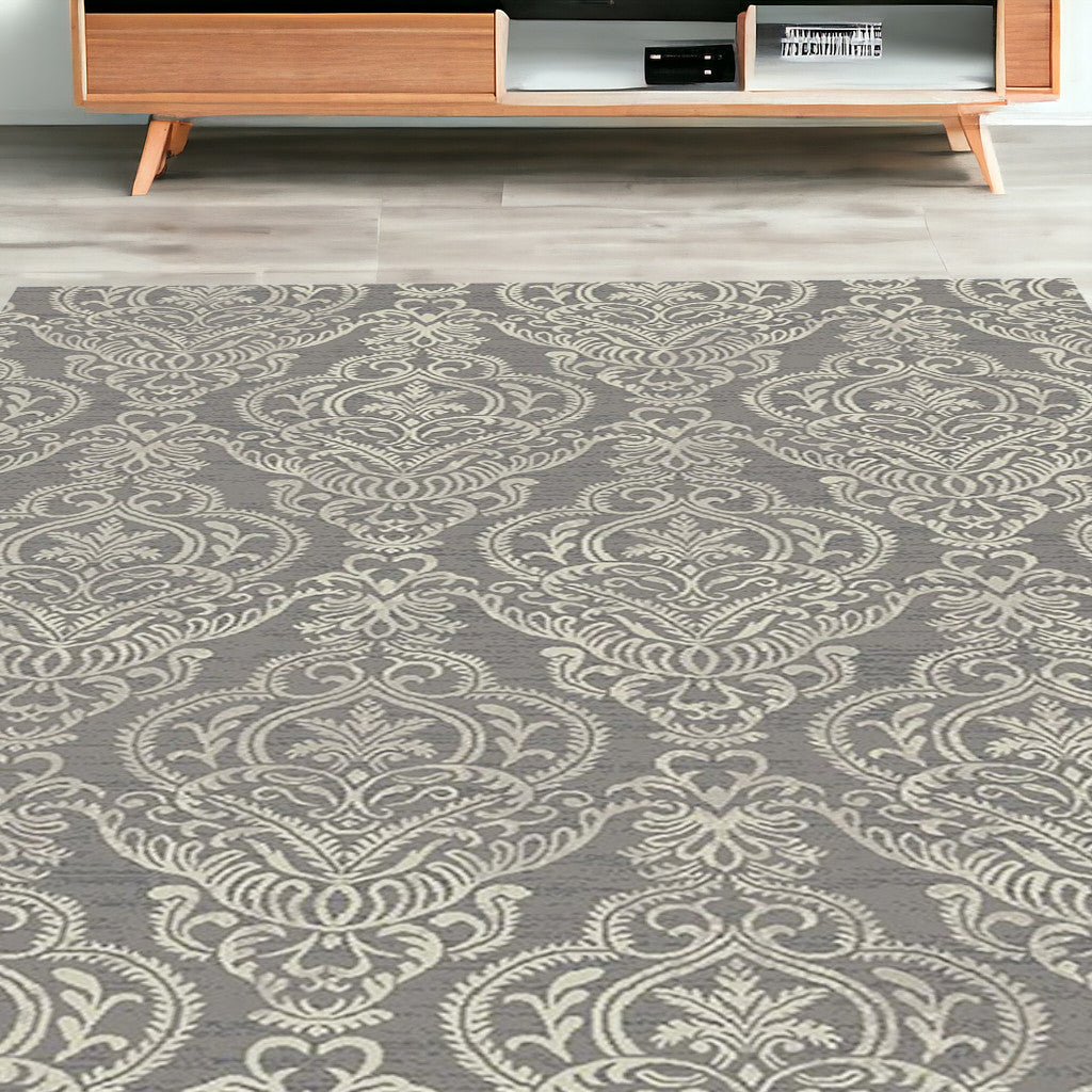 5' x 8' Gray and Beige Damask Area Rug