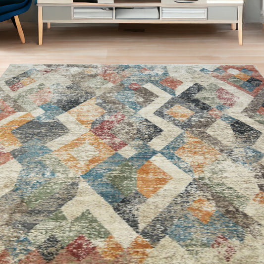 5' x 8' Beige Blue and Gray Geometric Distressed Area Rug With Fringe