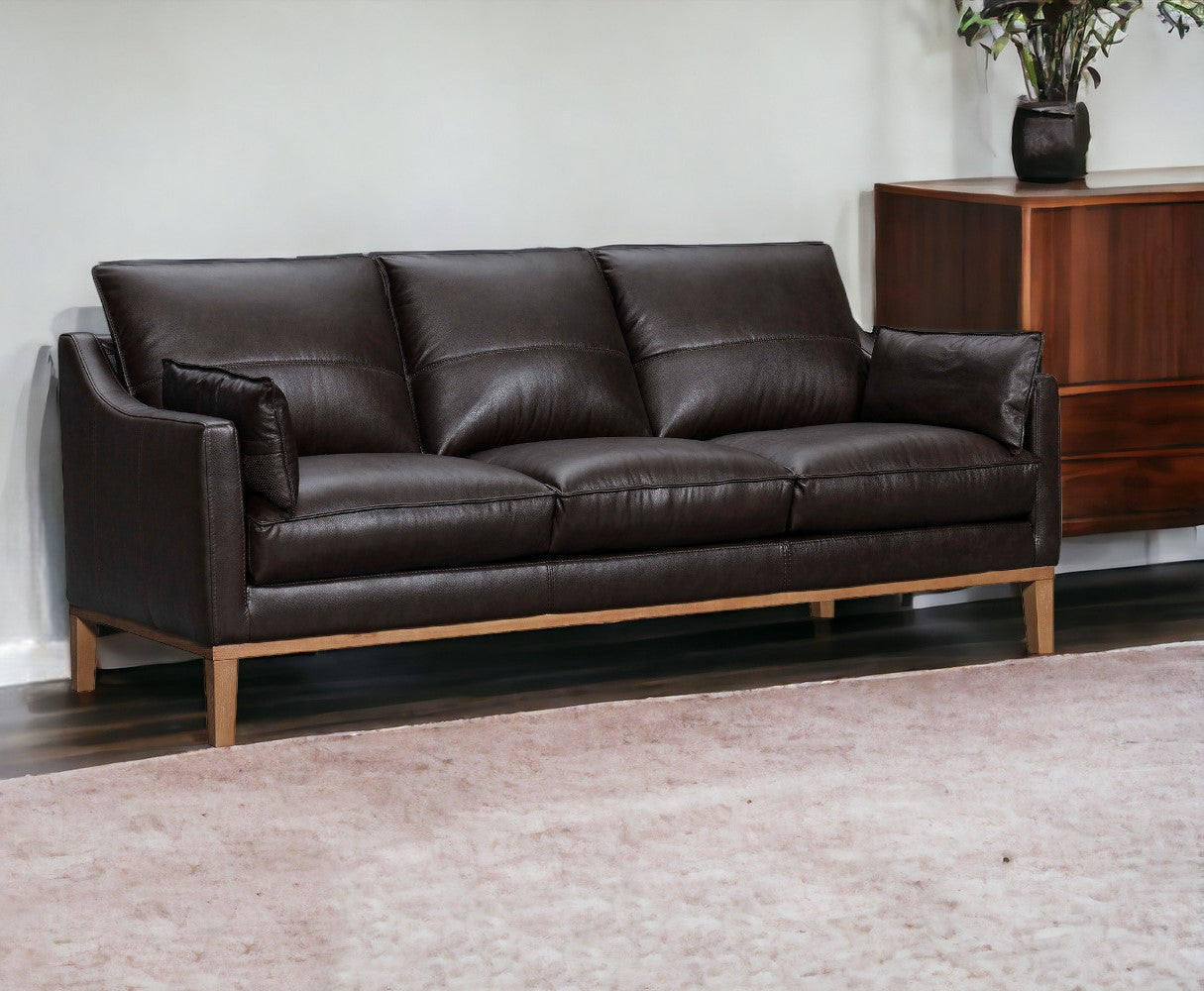 87" Dark Brown Leather Sofa And Toss Pillows