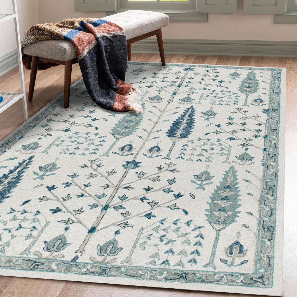 5' x 8' Ivory and Blue Wool Floral Hand Tufted Area Rug