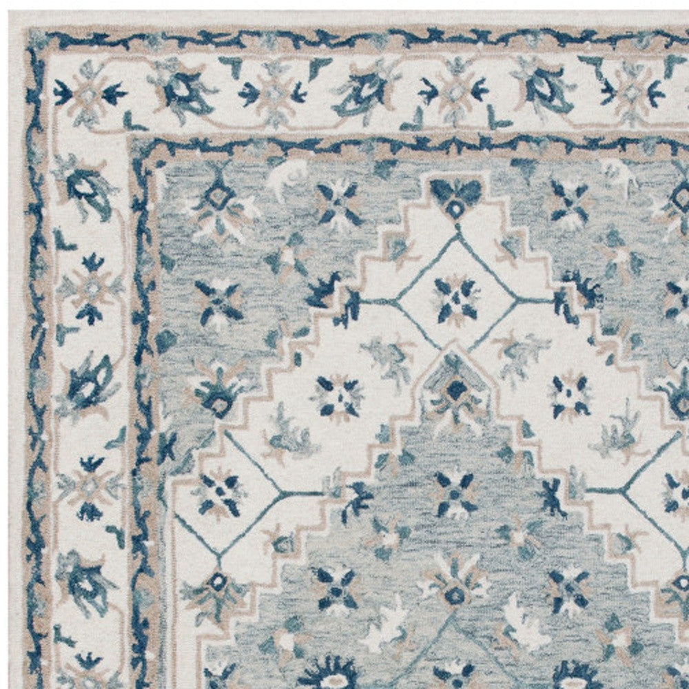9' x 12' Blue and Ivory Wool Floral Hand Tufted Area Rug