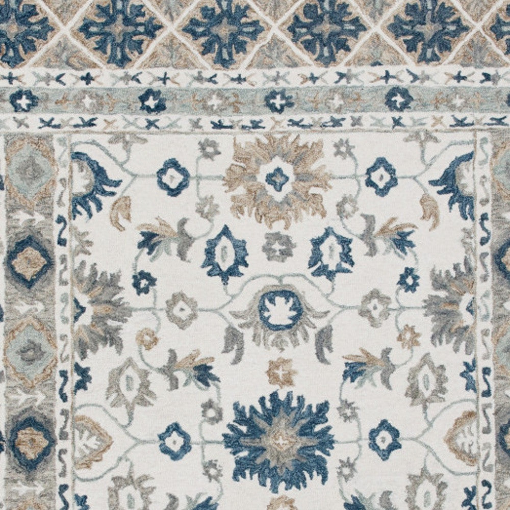 9' x 12' Blue and Ivory Wool Floral Hand Tufted Area Rug