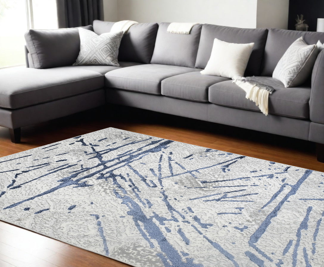 9' x 12' Ivory and Blue Abstract Area Rug