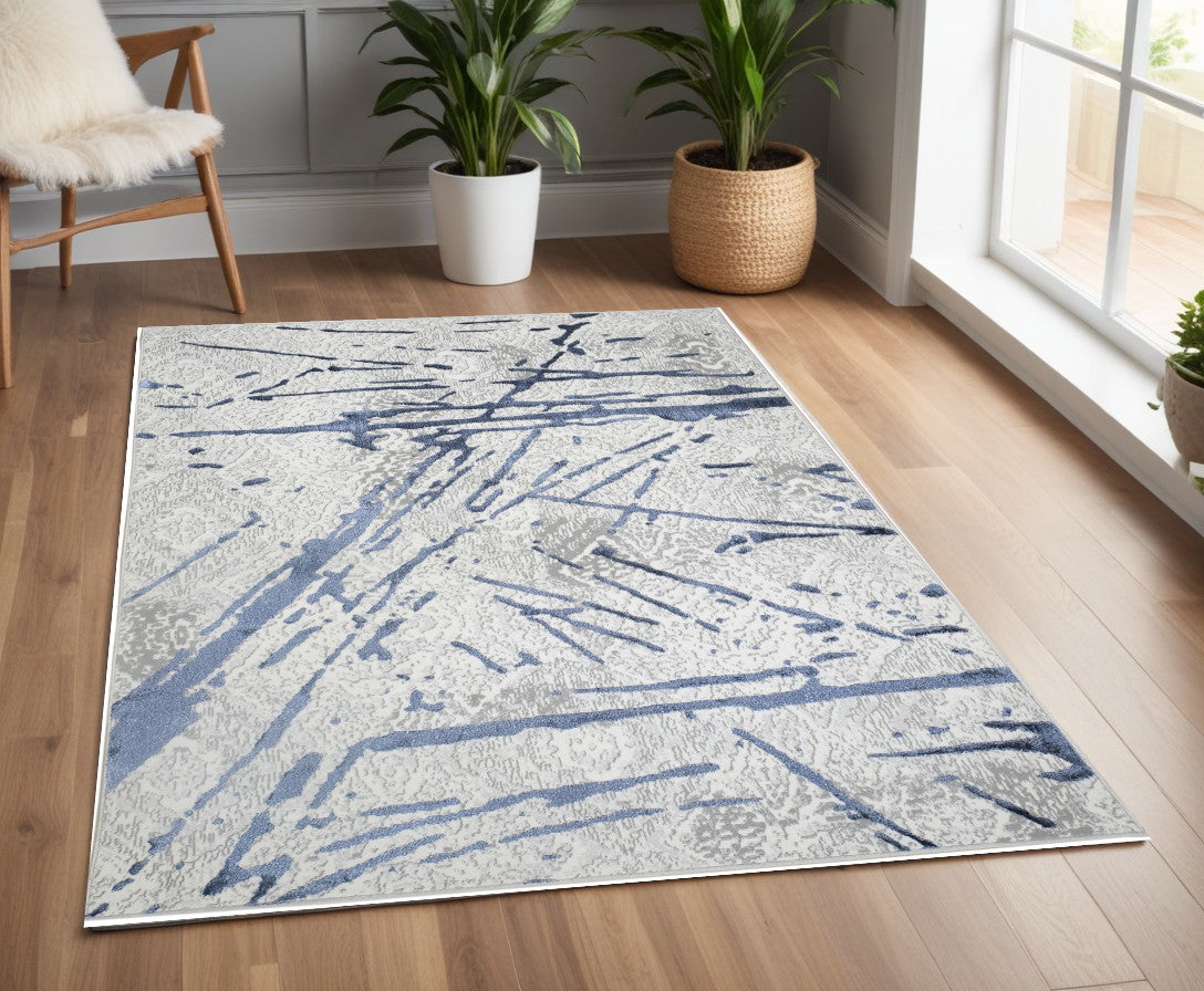 4' x 6' Ivory and Blue Abstract Area Rug