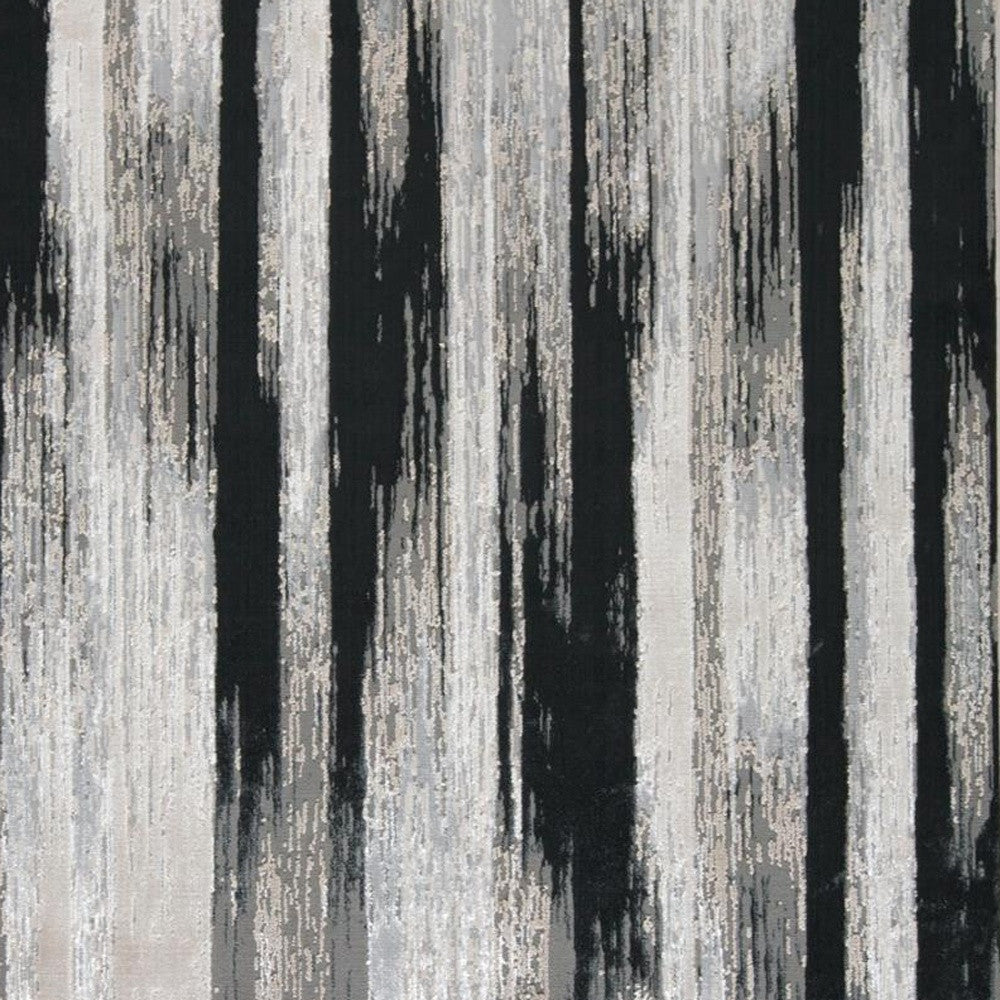 5' x 8' Black Silver and Gray Abstract Power Loom Area Rug