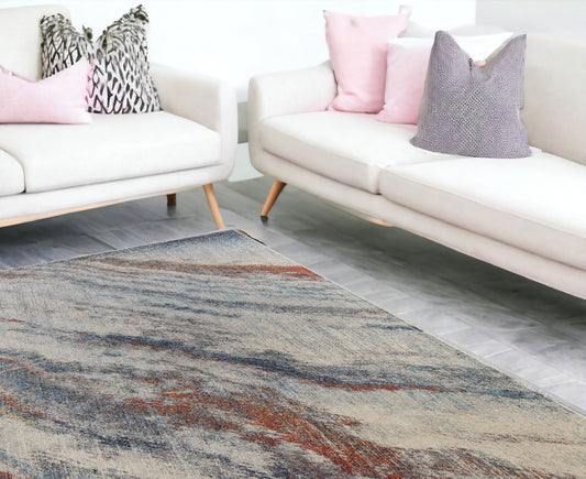 7' x 10' Ivory Blue and Orange Abstract Power Loom Area Rug