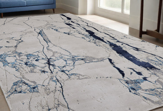5' x 8' Ivory and Blue Marble Power Loom Distressed Area Rug