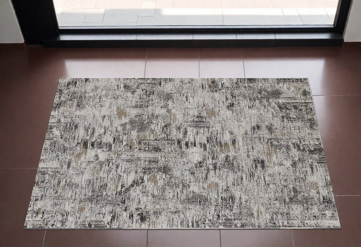 2' x 3' Brown and Ivory Abstract Power Loom Distressed Area Rug