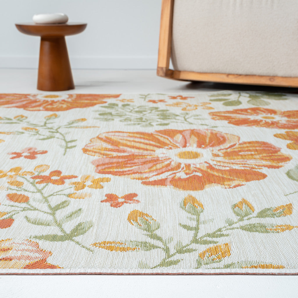 5' x 7' Ivory Green and Orange Floral Stain Resistant Indoor Outdoor Area Rug