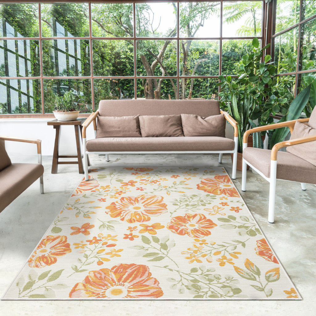 5' x 7' Ivory Green and Orange Floral Stain Resistant Indoor Outdoor Area Rug