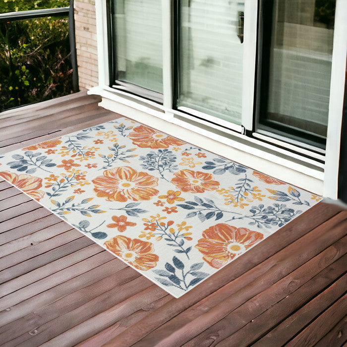 2' x 3' Ivory Orange and Blue Floral Stain Resistant Indoor Outdoor Area Rug