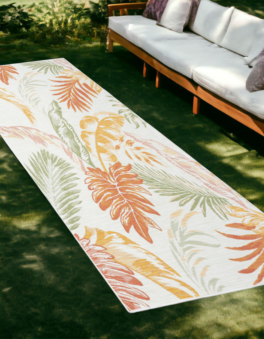 2' X 8' Ivory Green and Orange Palm Leaf Stain Resistant Indoor Outdoor Runner Rug